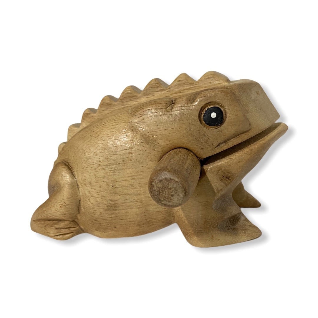 Natural wooden frog with mallet, showcasing craftsmanship and design.