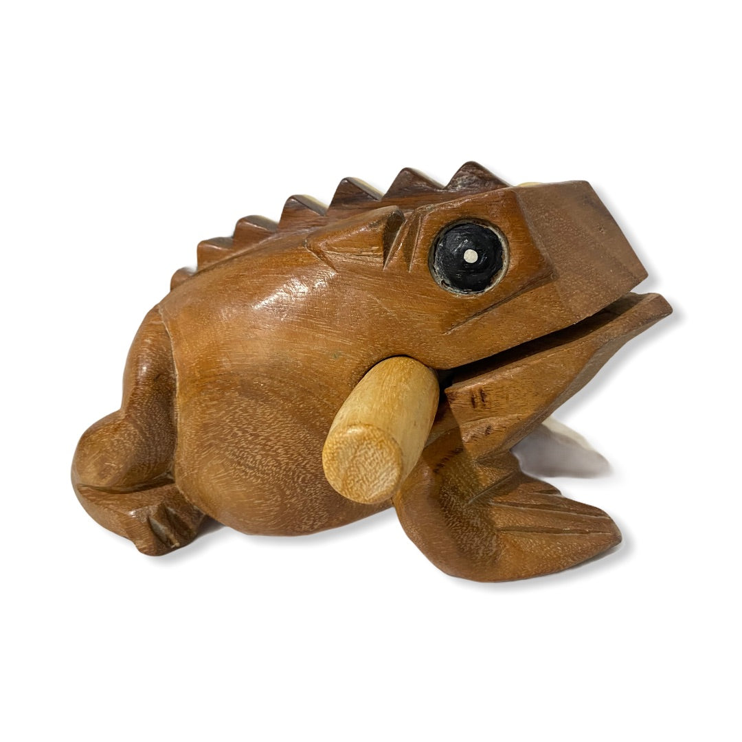 Natural wooden frog with mallet, showcasing craftsmanship and design.