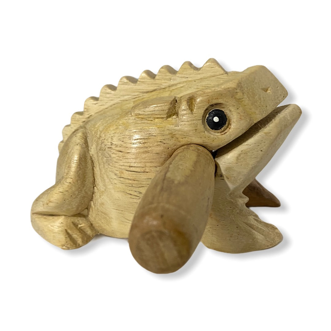 Natural wooden frog with mallet, showcasing craftsmanship and design.