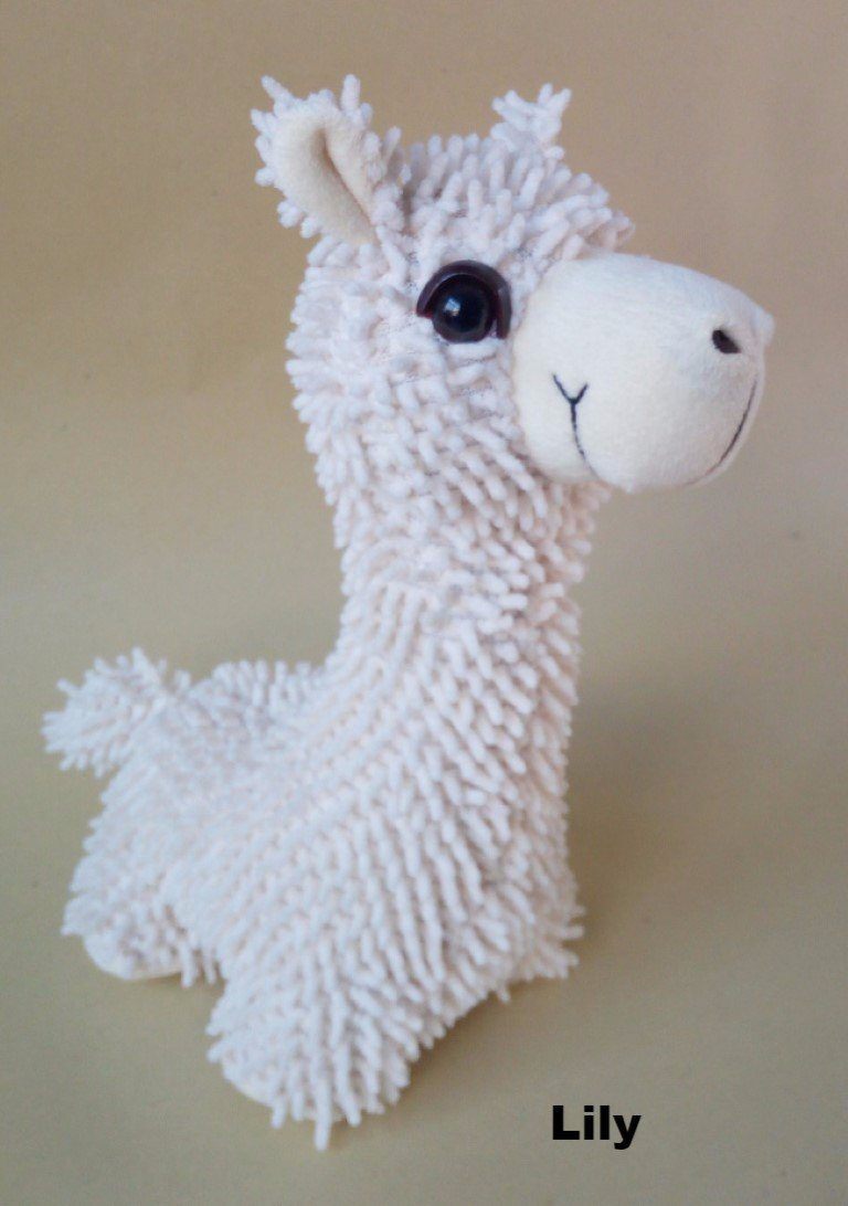 A collection of PacaBuddies Stuffed Alpaca Toys in various colors, showcasing their cute and cuddly design, perfect for alpaca lovers.