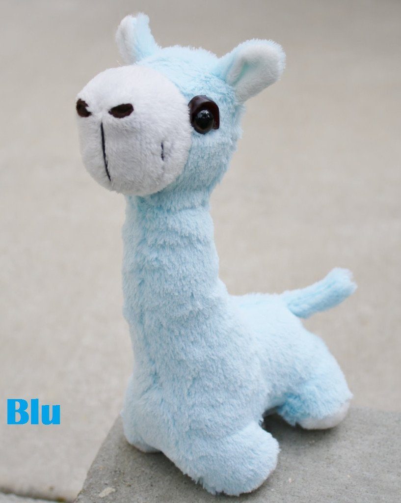 A collection of PacaBuddies Stuffed Alpaca Toys in various colors, showcasing their cute and cuddly design, perfect for alpaca lovers.