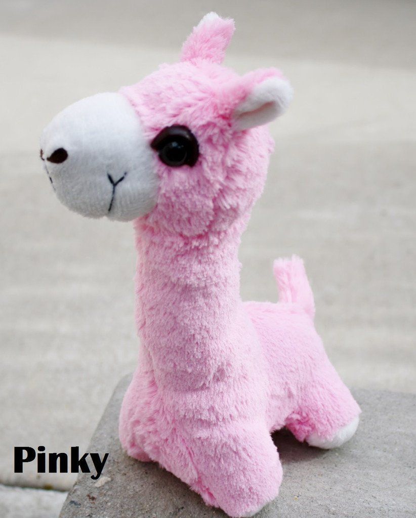 A collection of PacaBuddies Stuffed Alpaca Toys in various colors, showcasing their cute and cuddly design, perfect for alpaca lovers.