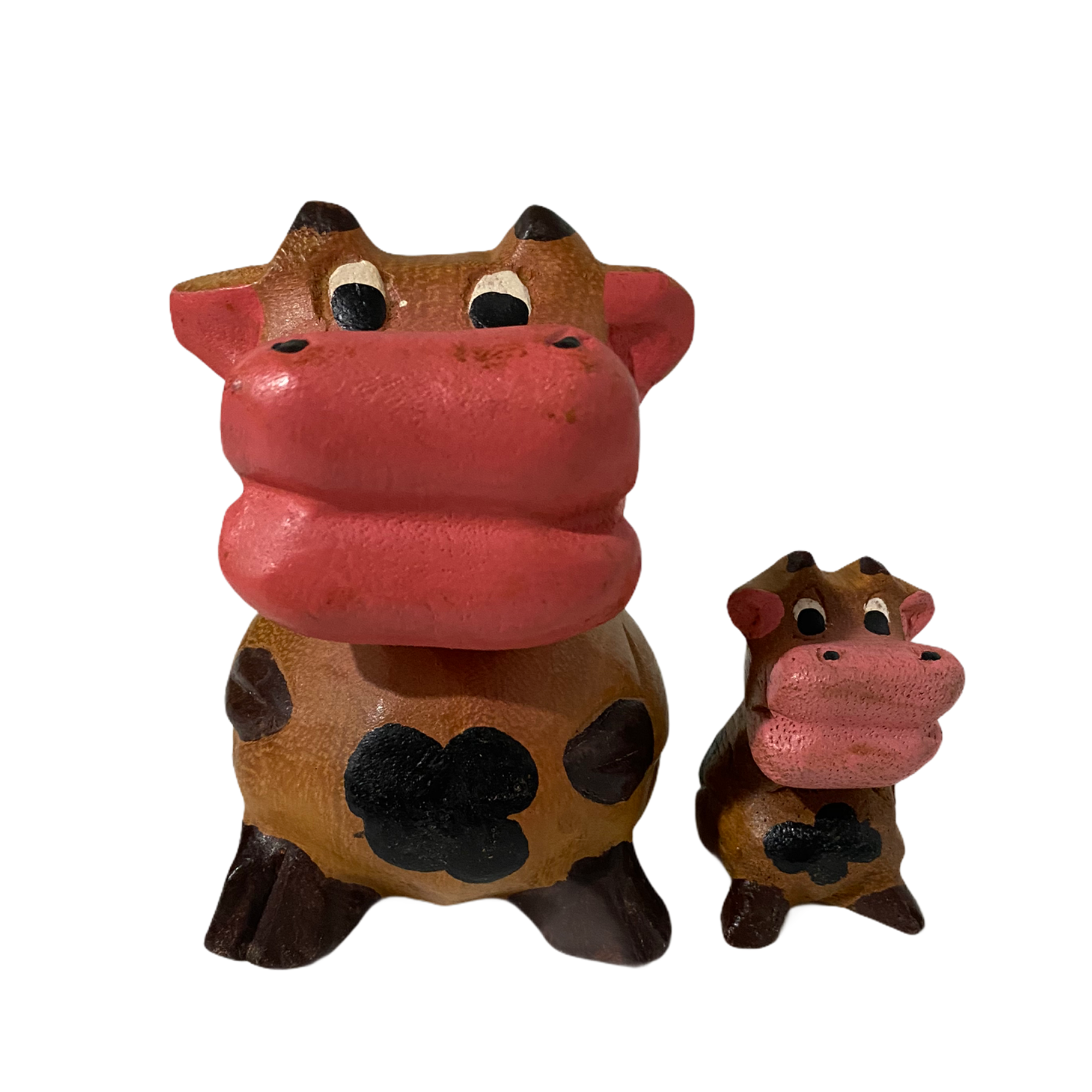 A hand-painted wooden musical whistle shaped like a cartoon cow, showcasing vibrant colors and intricate details, perfect for home decor.