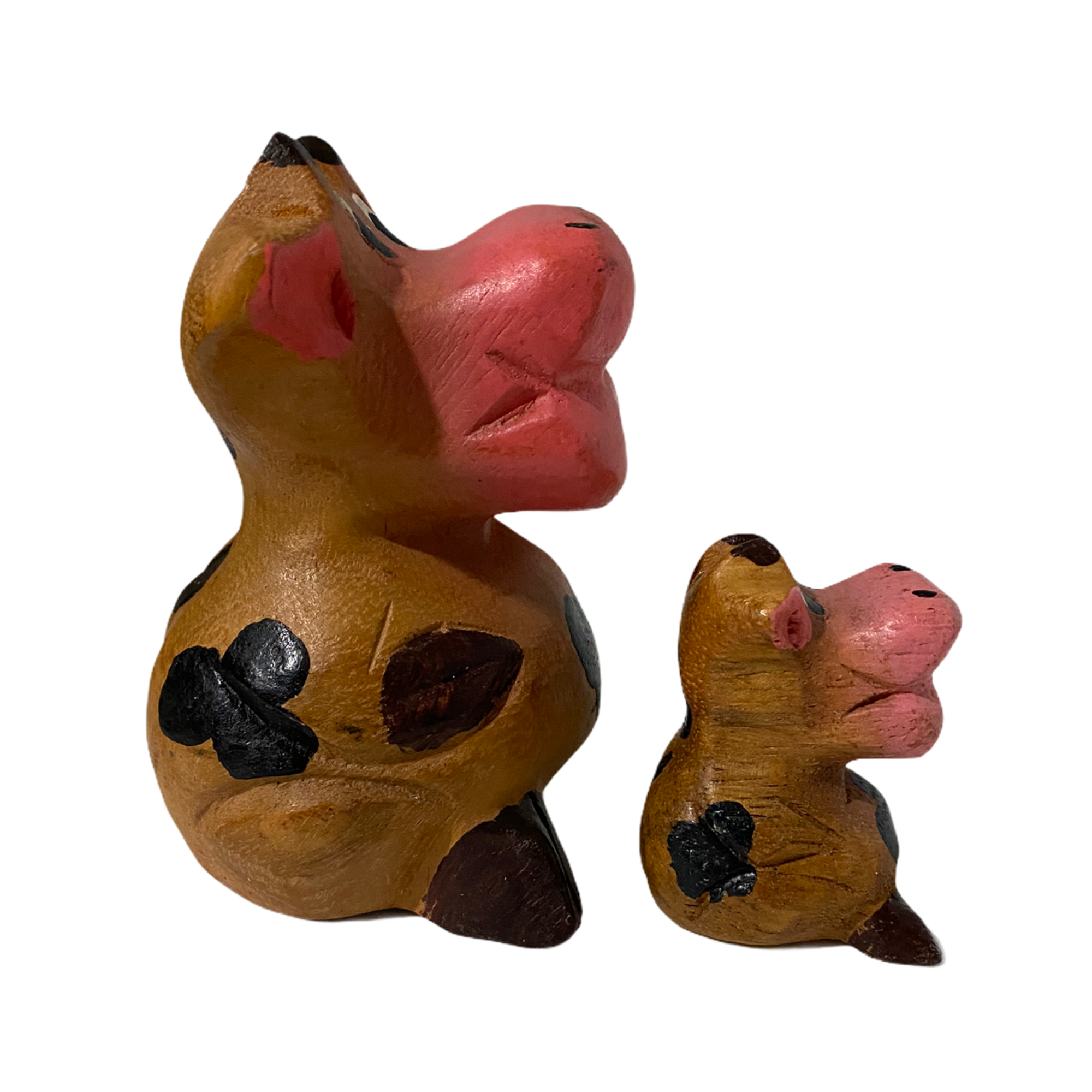 A hand-painted wooden musical whistle shaped like a cartoon cow, showcasing vibrant colors and intricate details, perfect for home decor.