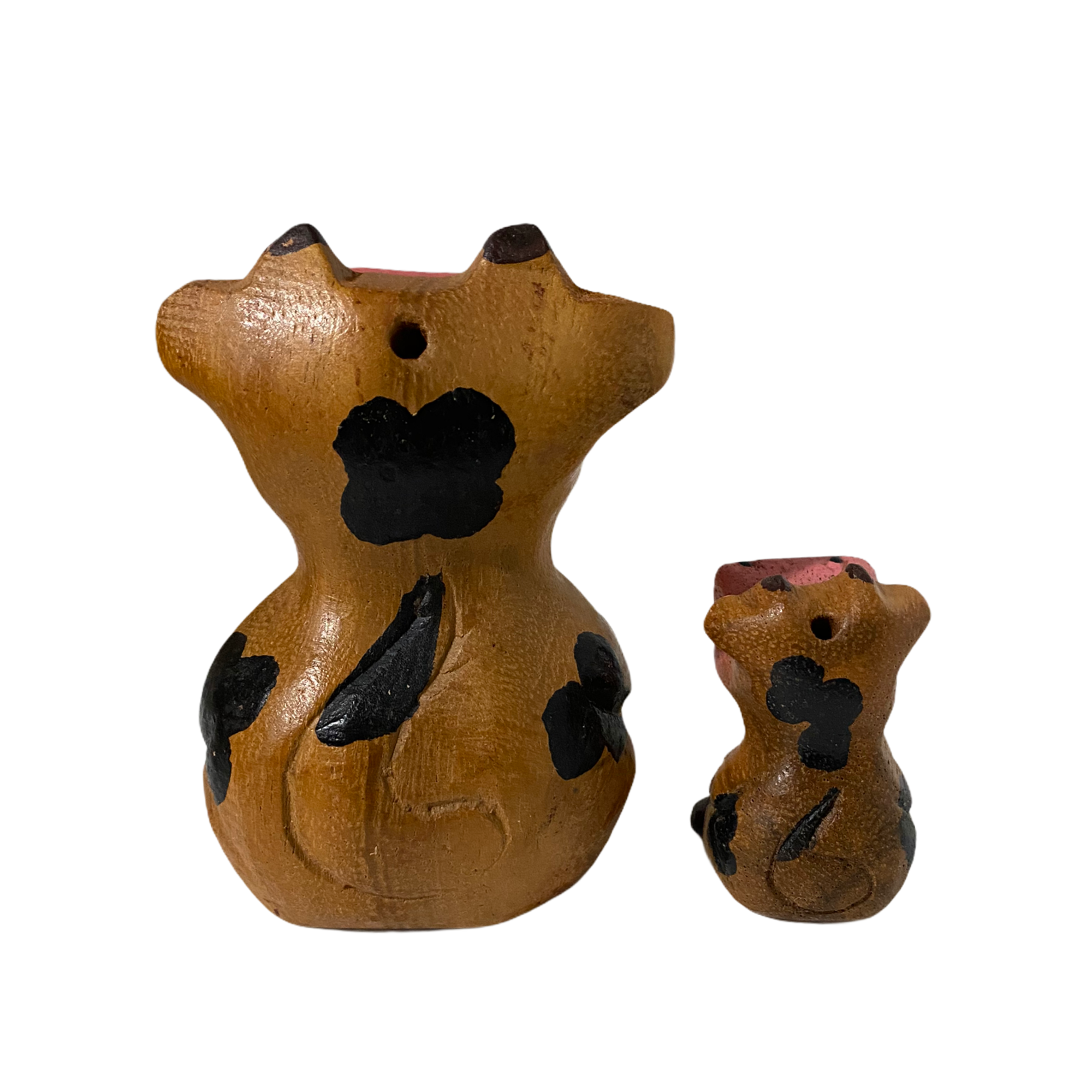 A hand-painted wooden musical whistle shaped like a cartoon cow, showcasing vibrant colors and intricate details, perfect for home decor.