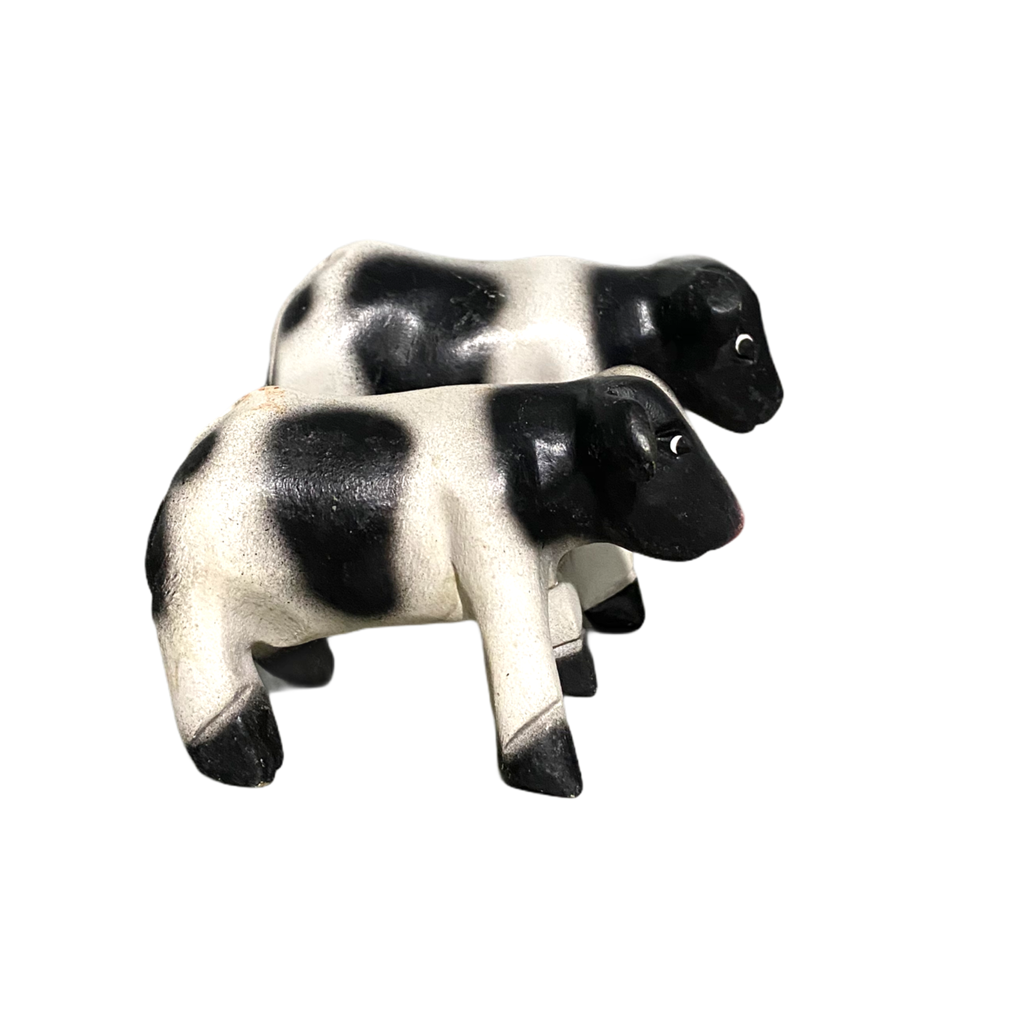 A beautifully handcrafted wooden cow whistle, painted in vibrant colors, showcasing intricate details and a whimsical design.