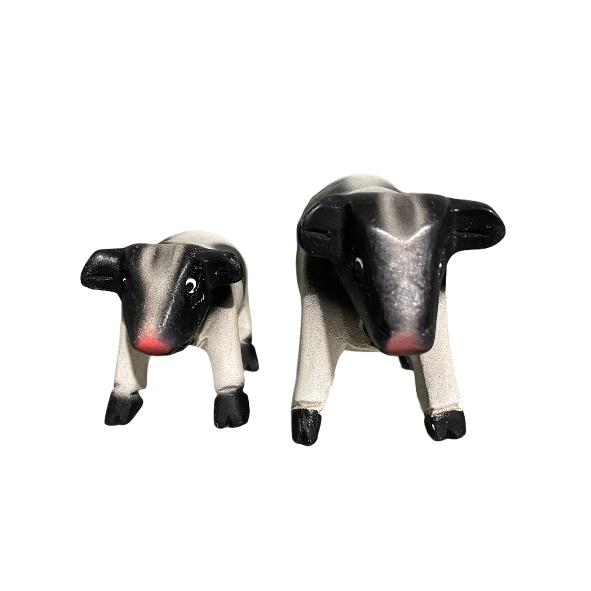 A beautifully handcrafted wooden cow whistle, painted in vibrant colors, showcasing intricate details and a whimsical design.