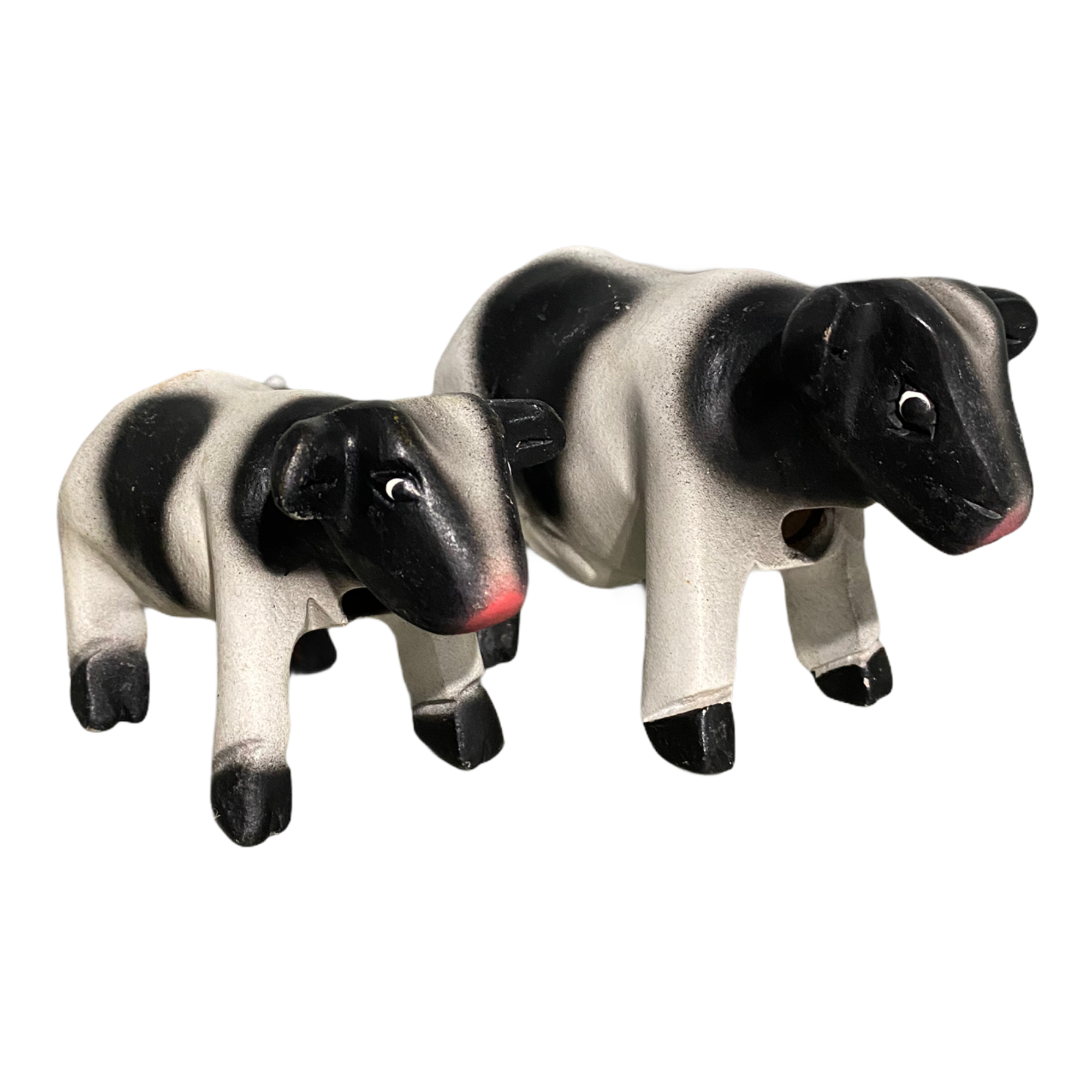 A beautifully handcrafted wooden cow whistle, painted in vibrant colors, showcasing intricate details and a whimsical design.