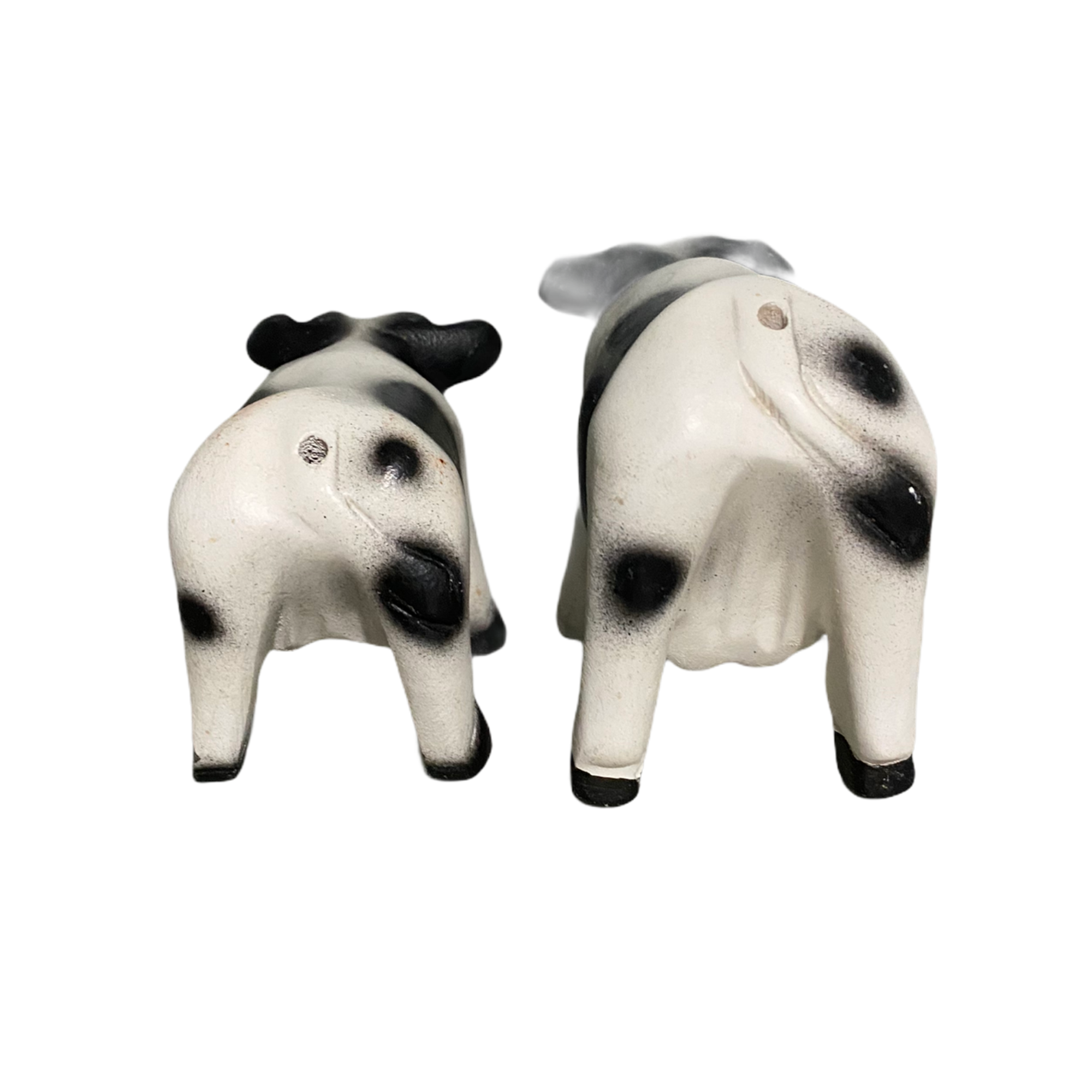 A beautifully handcrafted wooden cow whistle, painted in vibrant colors, showcasing intricate details and a whimsical design.