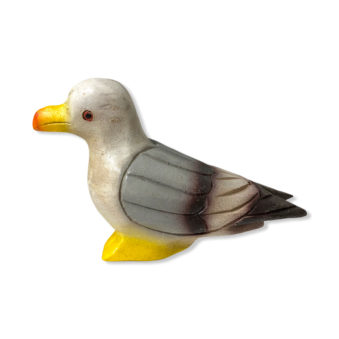A beautifully crafted painted wooden pigeon instrument that whistles, showcasing intricate details and a shiny finish.