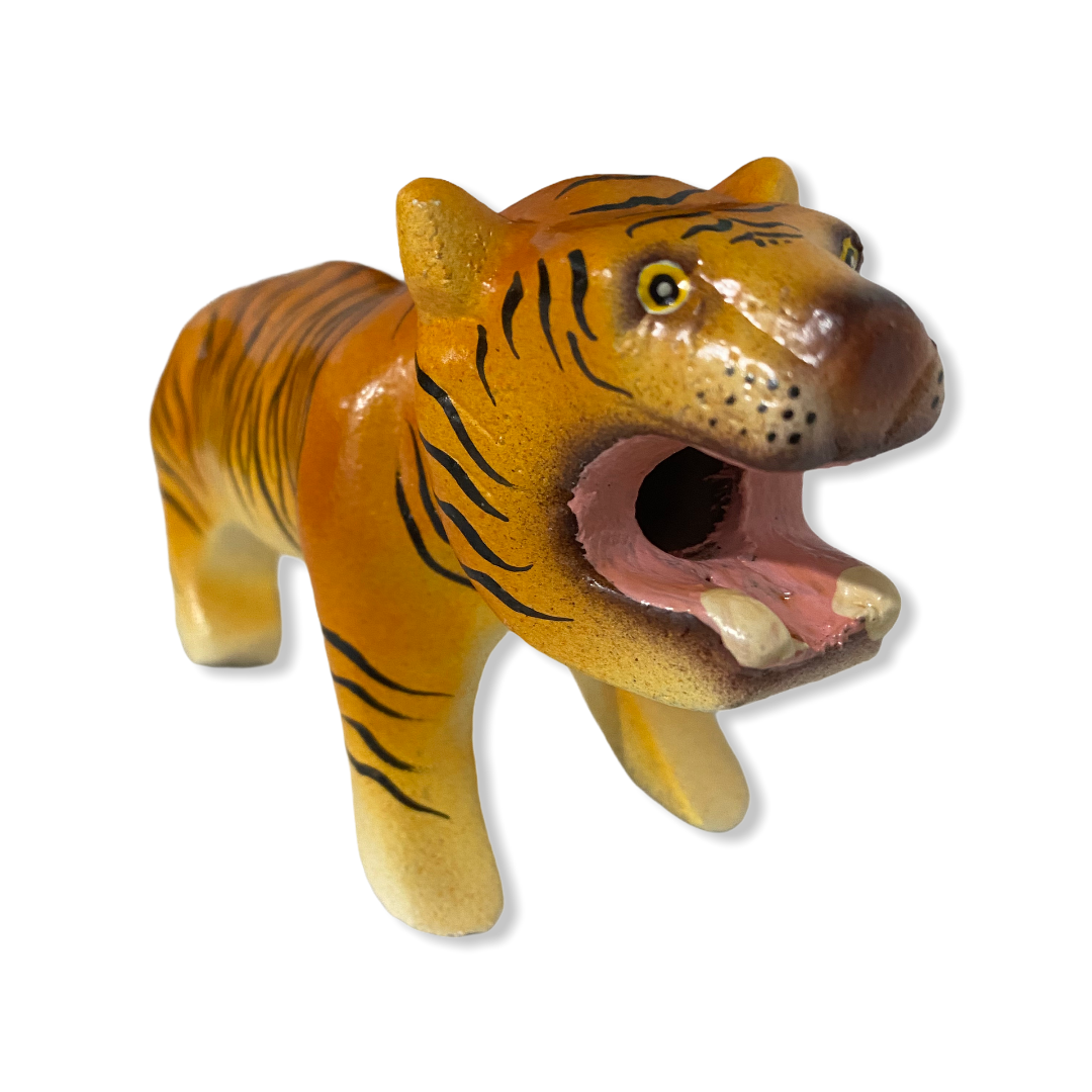 A colorful painted wooden tiger musical whistle instrument, showcasing intricate details and vibrant colors, perfect for children.