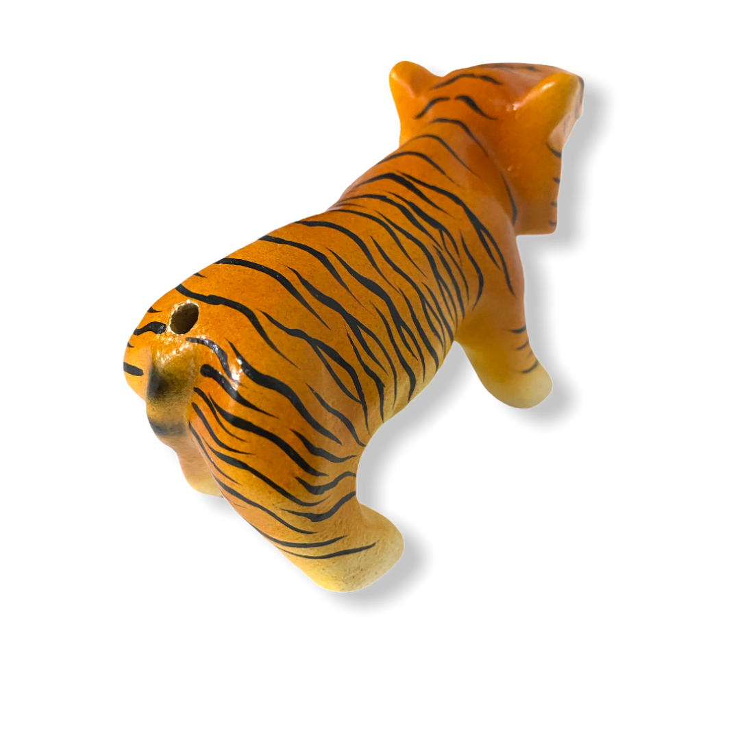 A colorful painted wooden tiger musical whistle instrument, showcasing intricate details and vibrant colors, perfect for children.