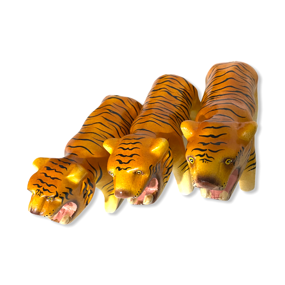 A colorful painted wooden tiger musical whistle instrument, showcasing intricate details and vibrant colors, perfect for children.