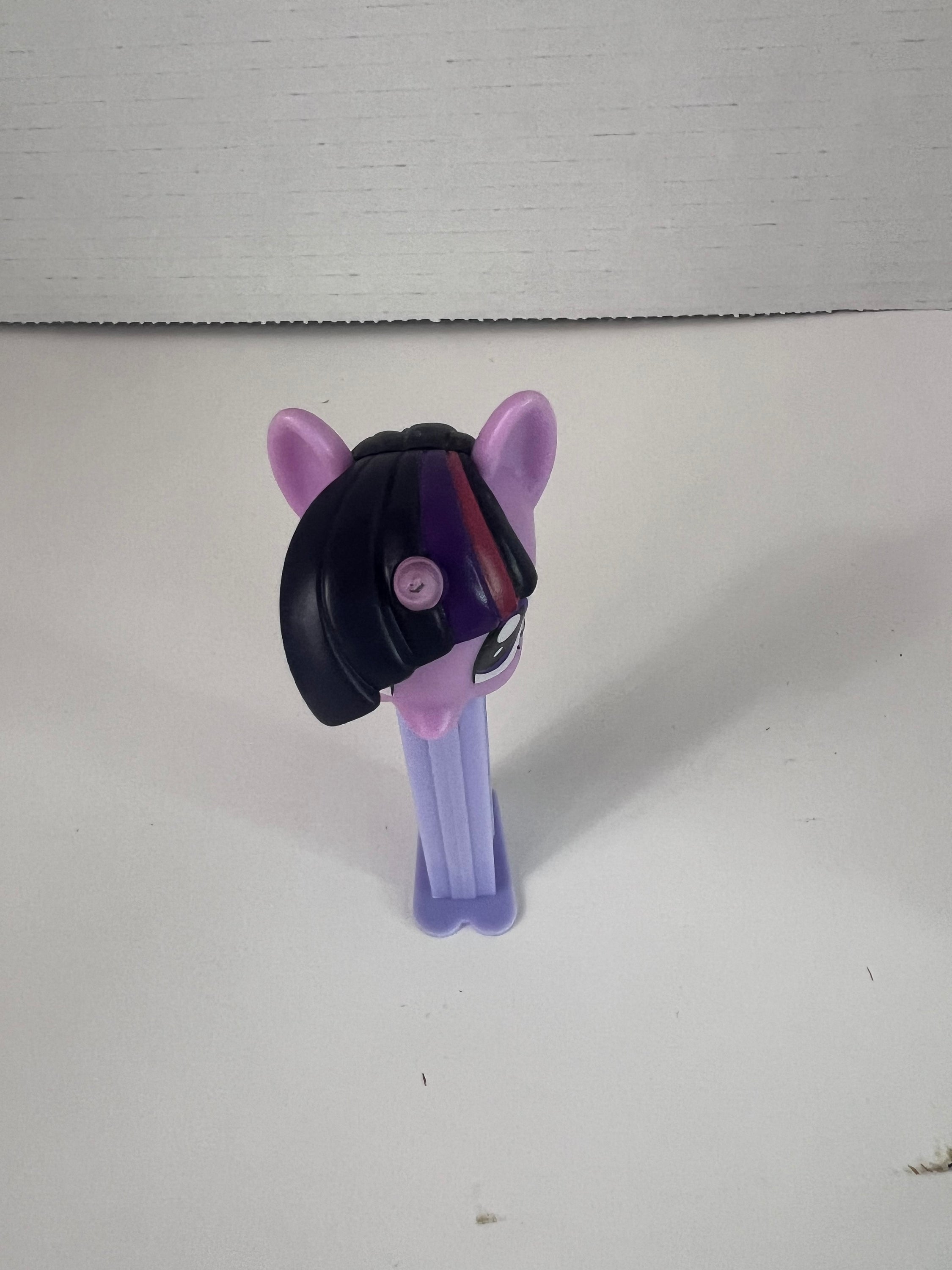 Pez dispenser featuring My Little Pony character Twilight Sparkle, colorful and collectible.
