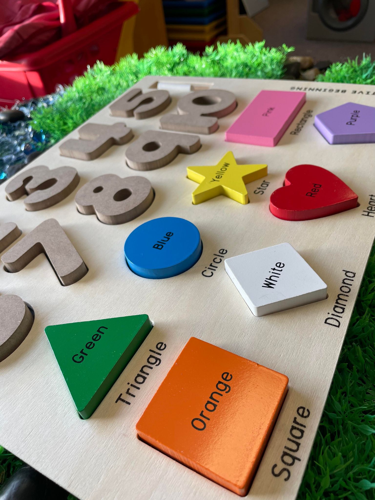 A colorful Preschool Chalkboard Puzzle featuring numbers, shapes, and colors designed for young learners to trace and practice writing.