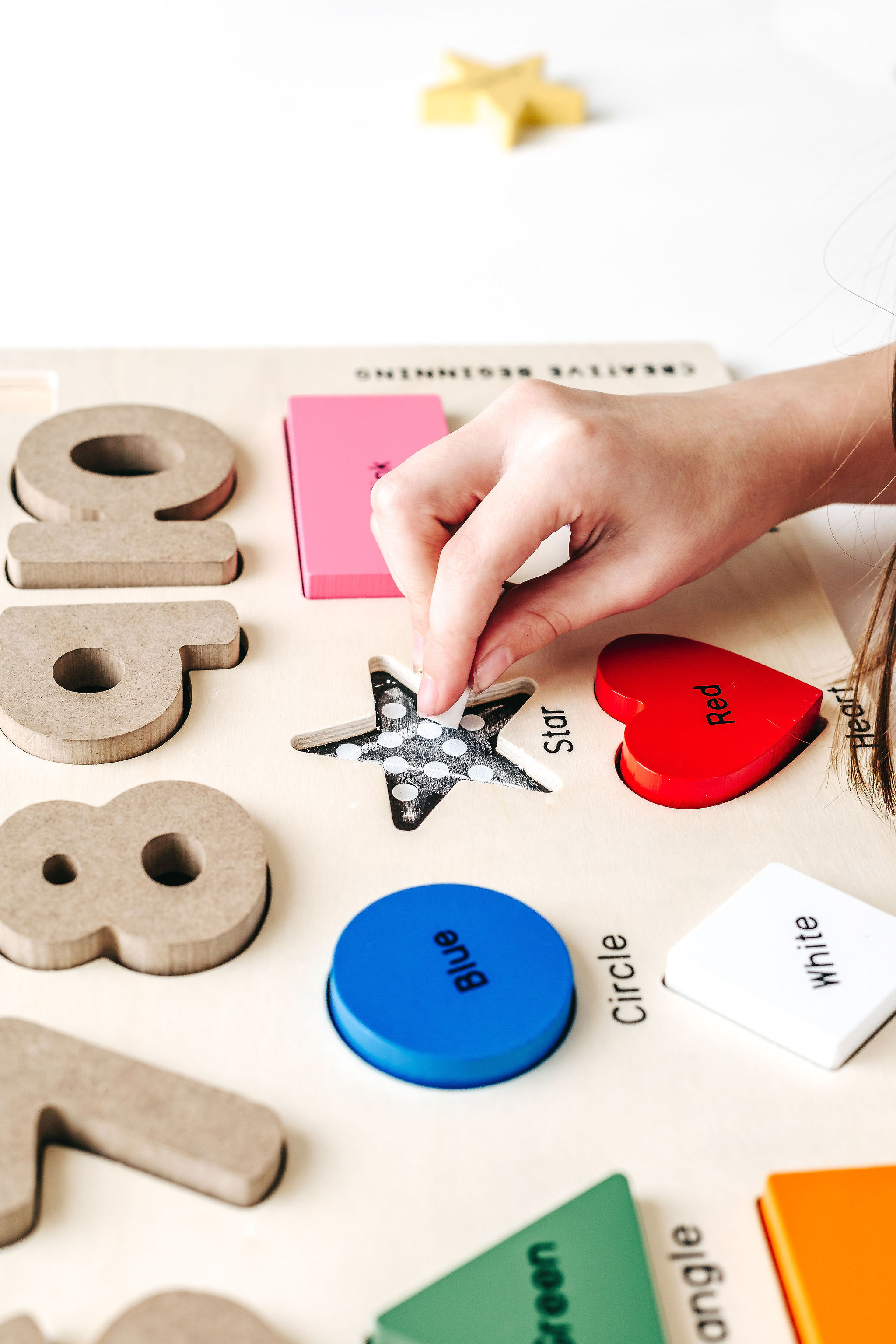 A colorful Preschool Chalkboard Puzzle featuring numbers, shapes, and colors designed for young learners to trace and practice writing.