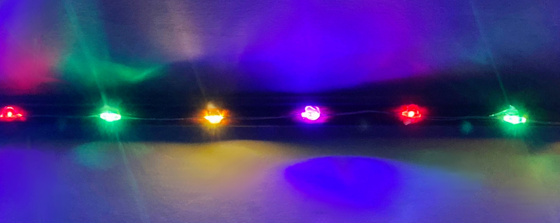 Rozanna's Cello Multi Color Glow Bow featuring vibrant mini lights and quality Brazilwood construction with ebony fittings.