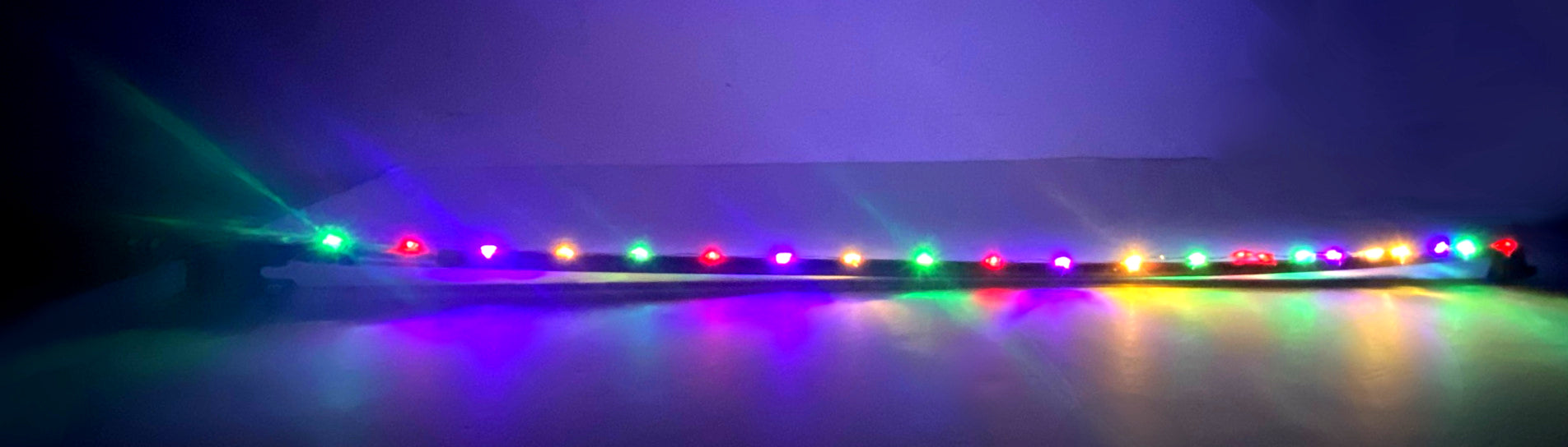 Rozanna's Cello Multi Color Glow Bow featuring vibrant mini lights and quality Brazilwood construction with ebony fittings.