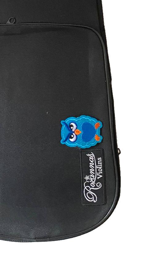 Rozanna's Mystic Owl Blue Glitter Violin featuring a solid spruce top, blue glitter finish, and unique owl artwork with a matching blue bow.