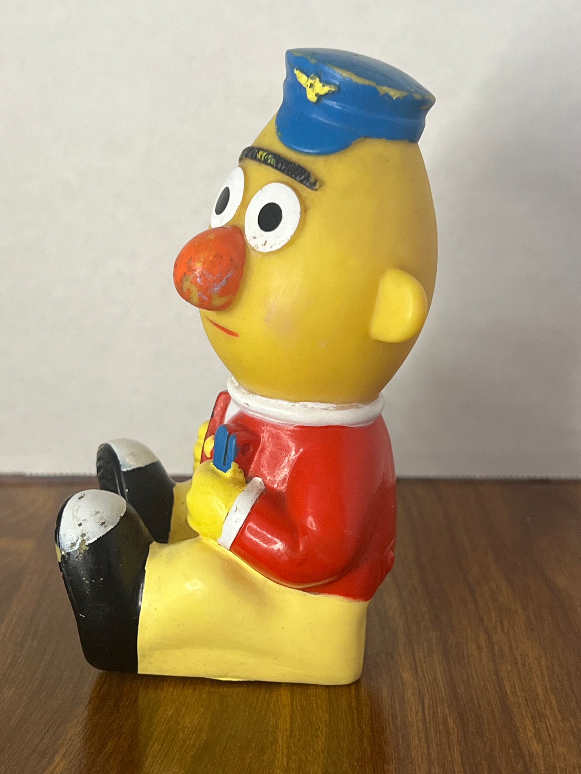 1989 Sesame Street Big Bird's Wind Up Train featuring Bert, colorful toy with minor paint wear, perfect for collectors.