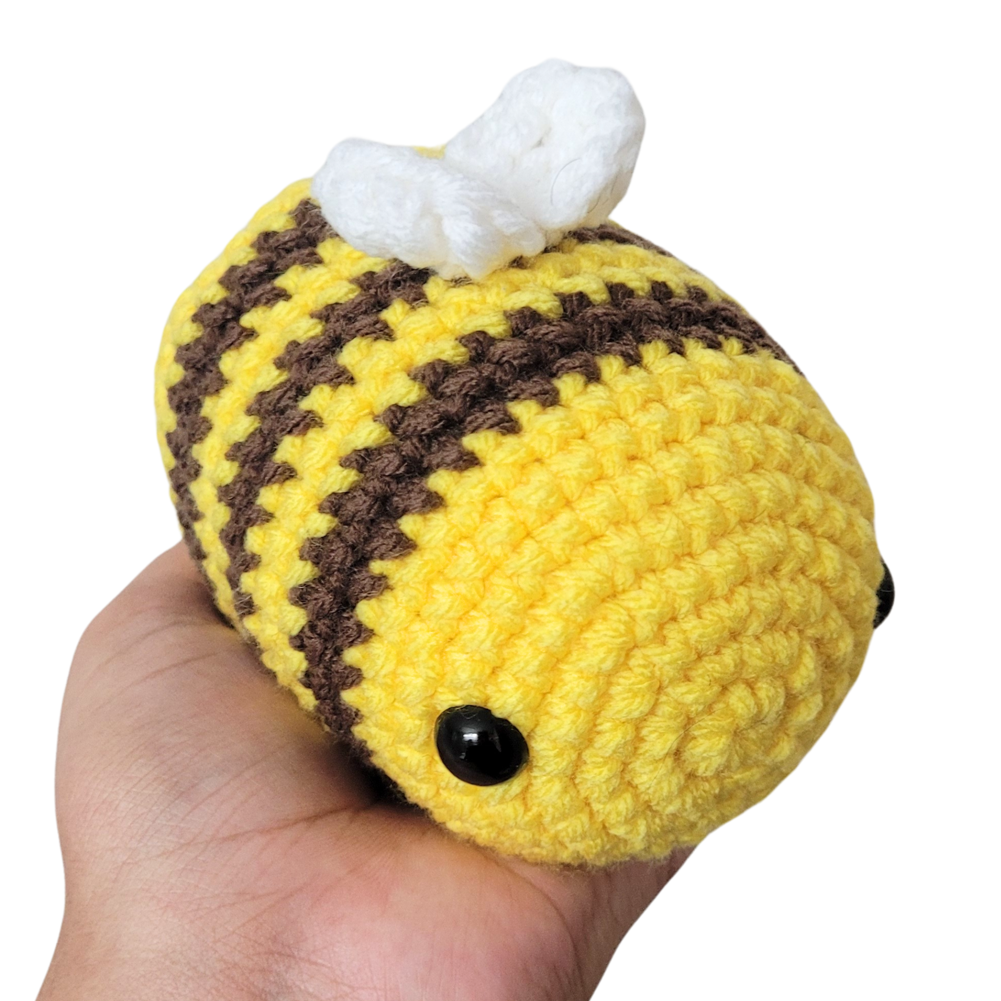 A cute Small Amigurumi Crochet Bee Plushie, handmade with soft acrylic yarn, featuring a chubby body and vibrant colors, perfect for cuddling or decoration.