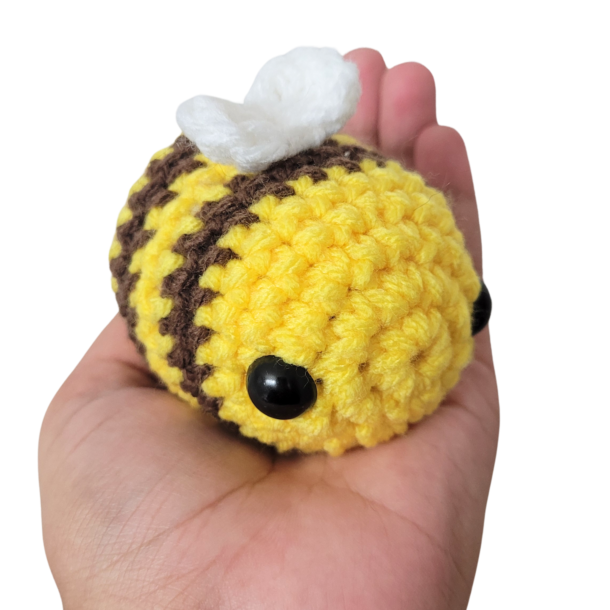 A cute Small Amigurumi Crochet Bee Plushie, handmade with soft acrylic yarn, featuring a chubby body and vibrant colors, perfect for cuddling or decoration.