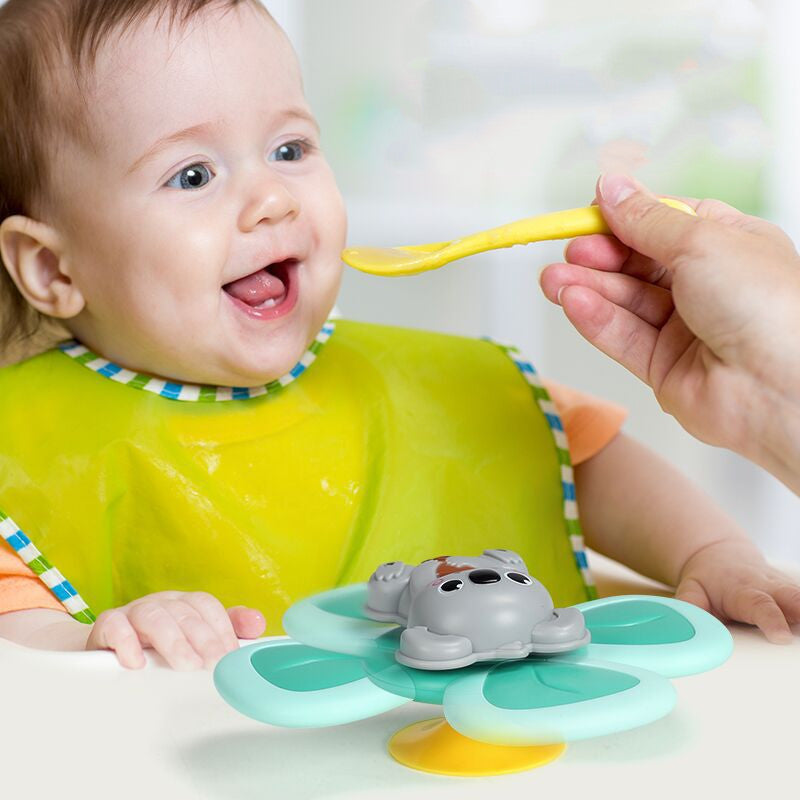 Colorful Spinning Top Baby Toy designed for bath and mealtime fun, featuring rotating elements and cute animal shapes.