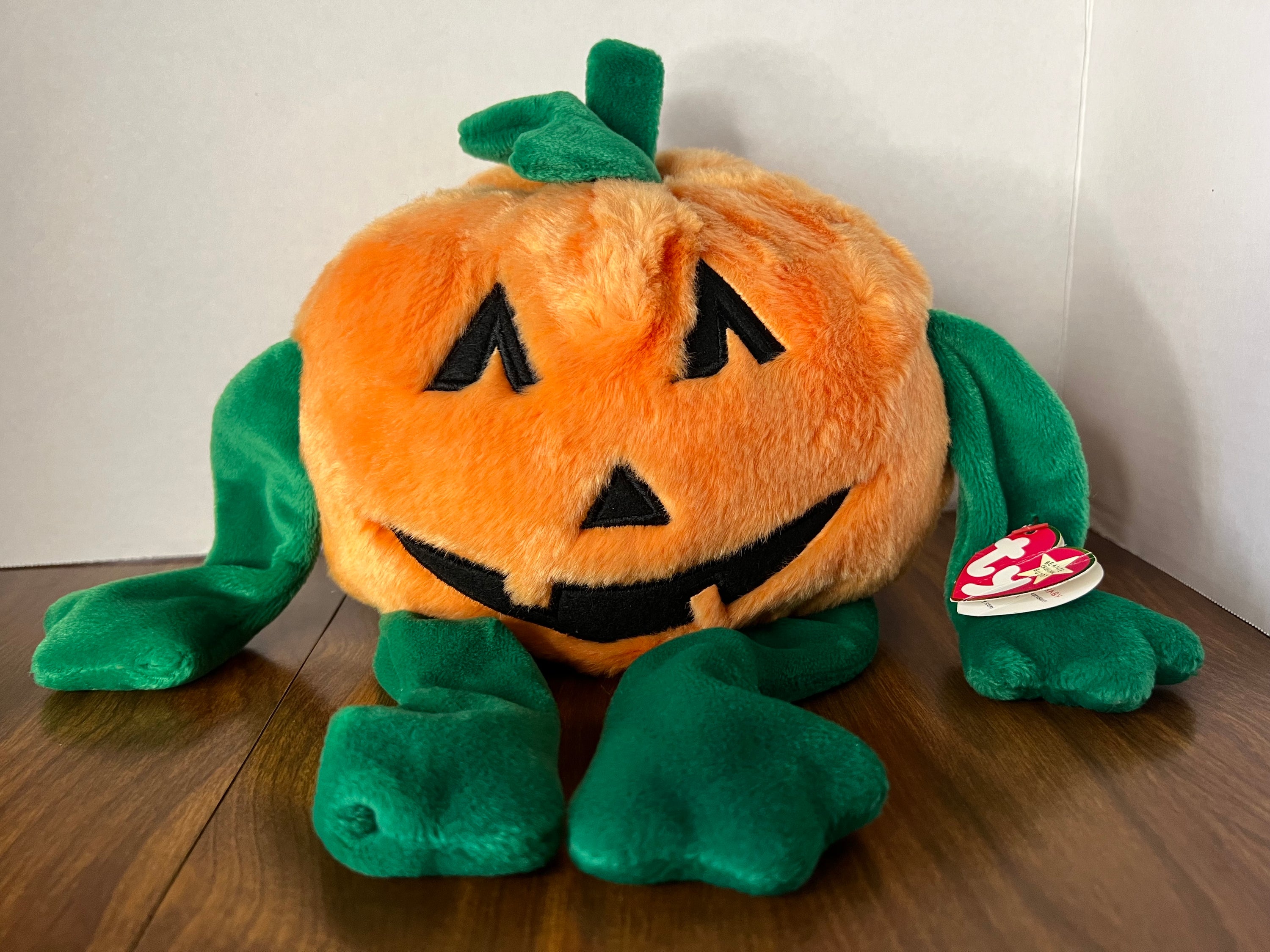 1999 Beanie Babies Collection Pumkin plush toy, bright orange with a cute design, perfect for collectors and children.