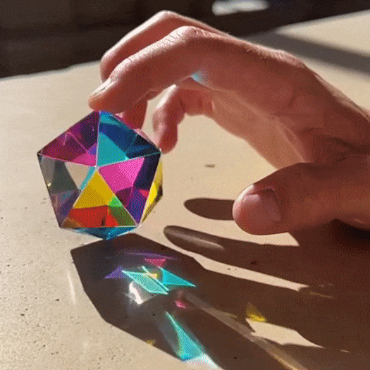 The Motus Icosahedron, a polyhedron with twenty triangular faces, showcasing its intricate geometric design.