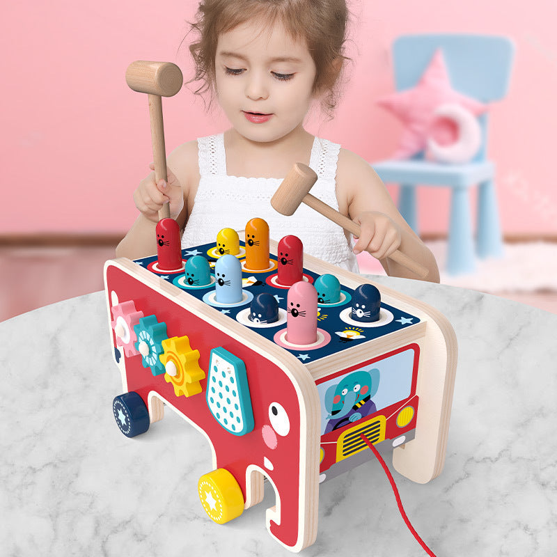 Colorful wooden pounding bench toy featuring cute animal designs for toddlers, promoting motor skills and sensory development.