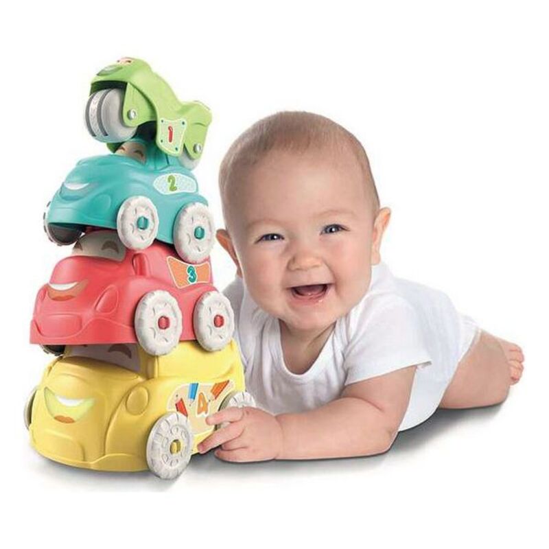 Baby playing with stackable toy cars.