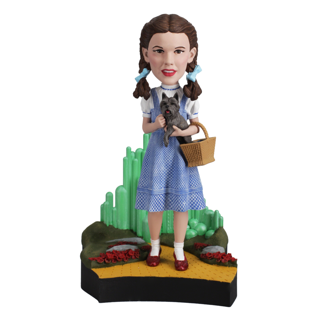Dorothy Gale Bobblehead from The Wizard of Oz, featuring her in a blue gingham dress and ruby slippers, capturing her iconic look.