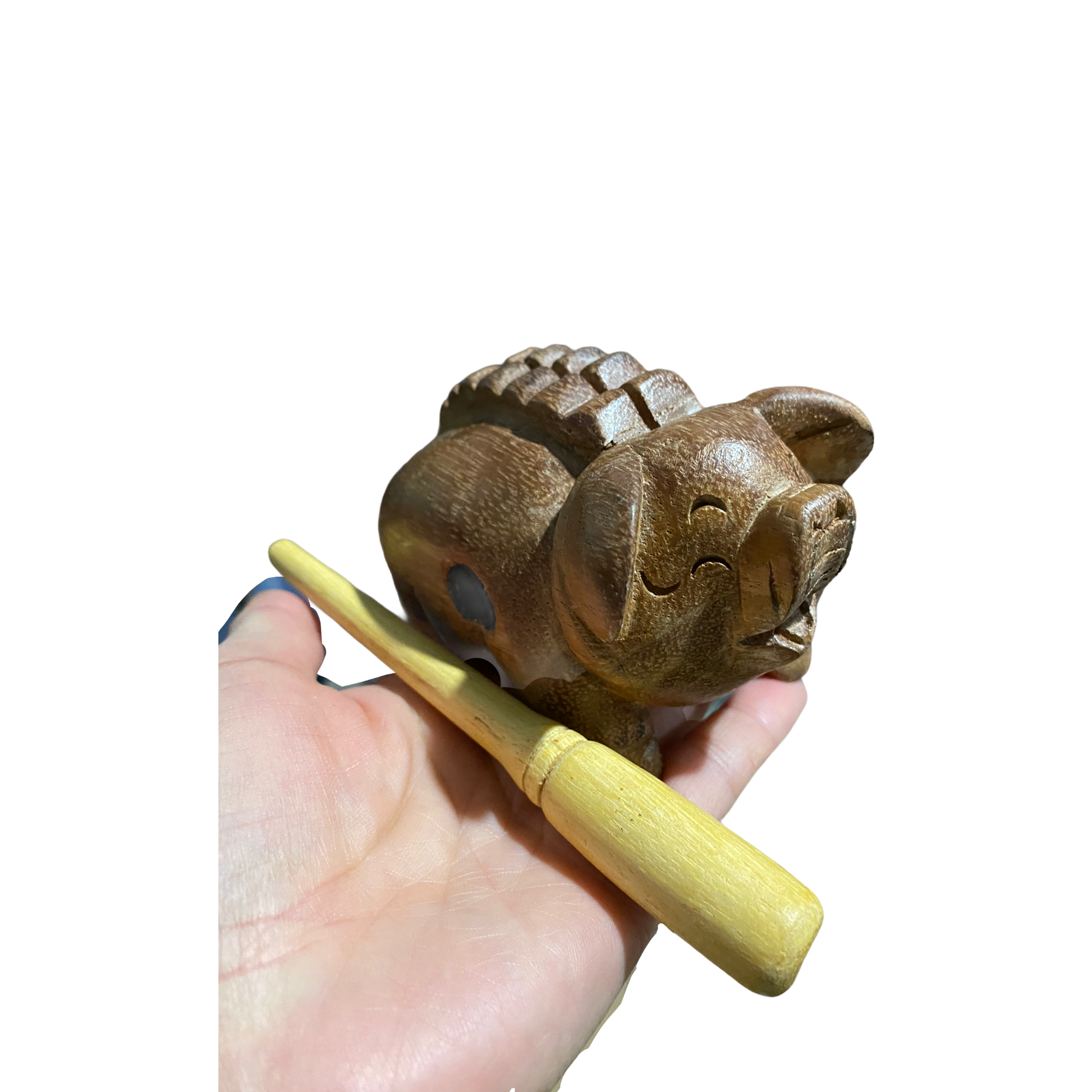 A handcrafted wooden musical pig percussion instrument with a mallet, showcasing its charming design and smooth finish.
