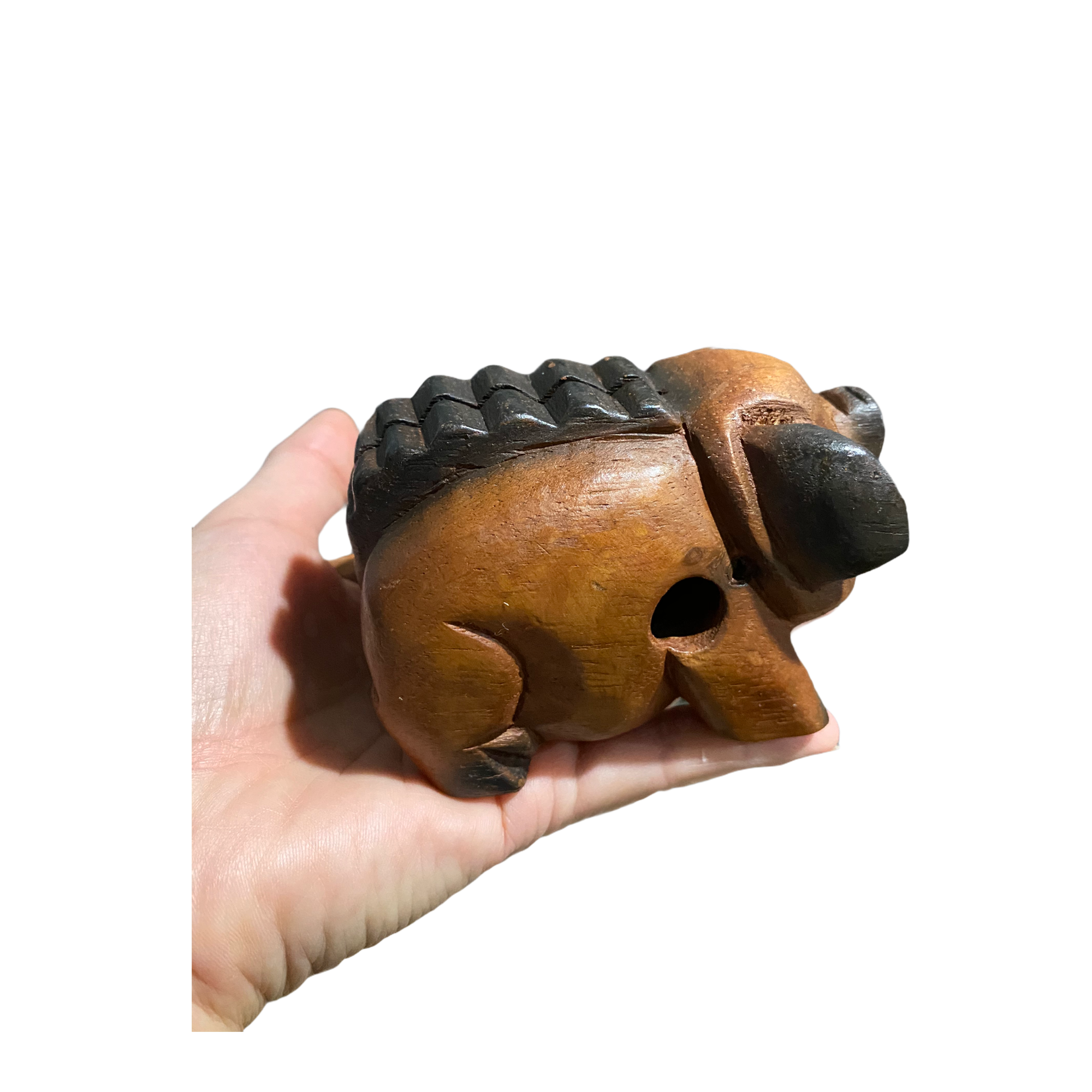 A handcrafted wooden musical pig percussion instrument with a mallet, showcasing its charming design and smooth finish.