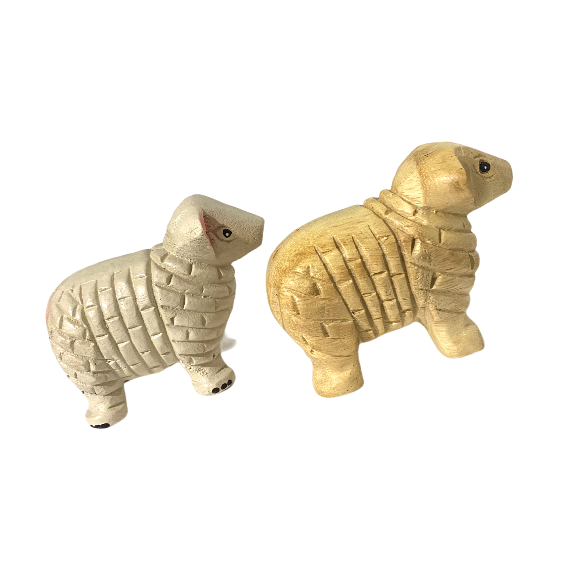 A charming wooden musical whistle shaped like a sheep, showcasing its intricate design and natural wood finish.