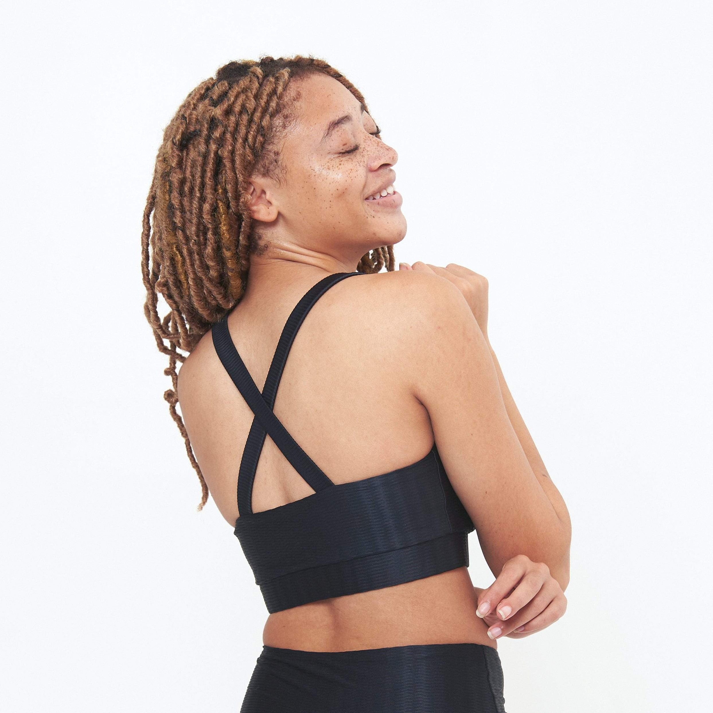 Cross Back Performance Bra Top in Black Zap Pattern, featuring double-layered design and wide cross-back straps for support.