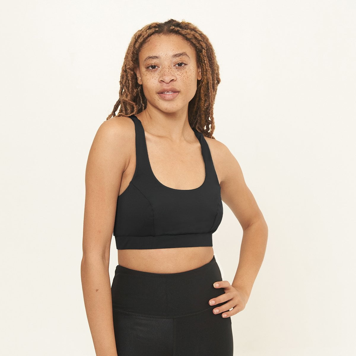 Cross Back Performance Bra Top in black, featuring wide cross-back straps and a double-layered scoop neck design for support and comfort.