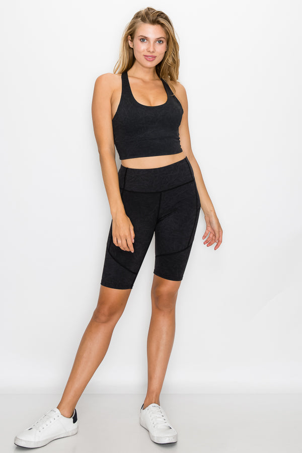 A pair of stylish Fringe Biker Shorts made from patterned fabric, showcasing a high-waisted design and breathable material, ideal for outdoor activities.