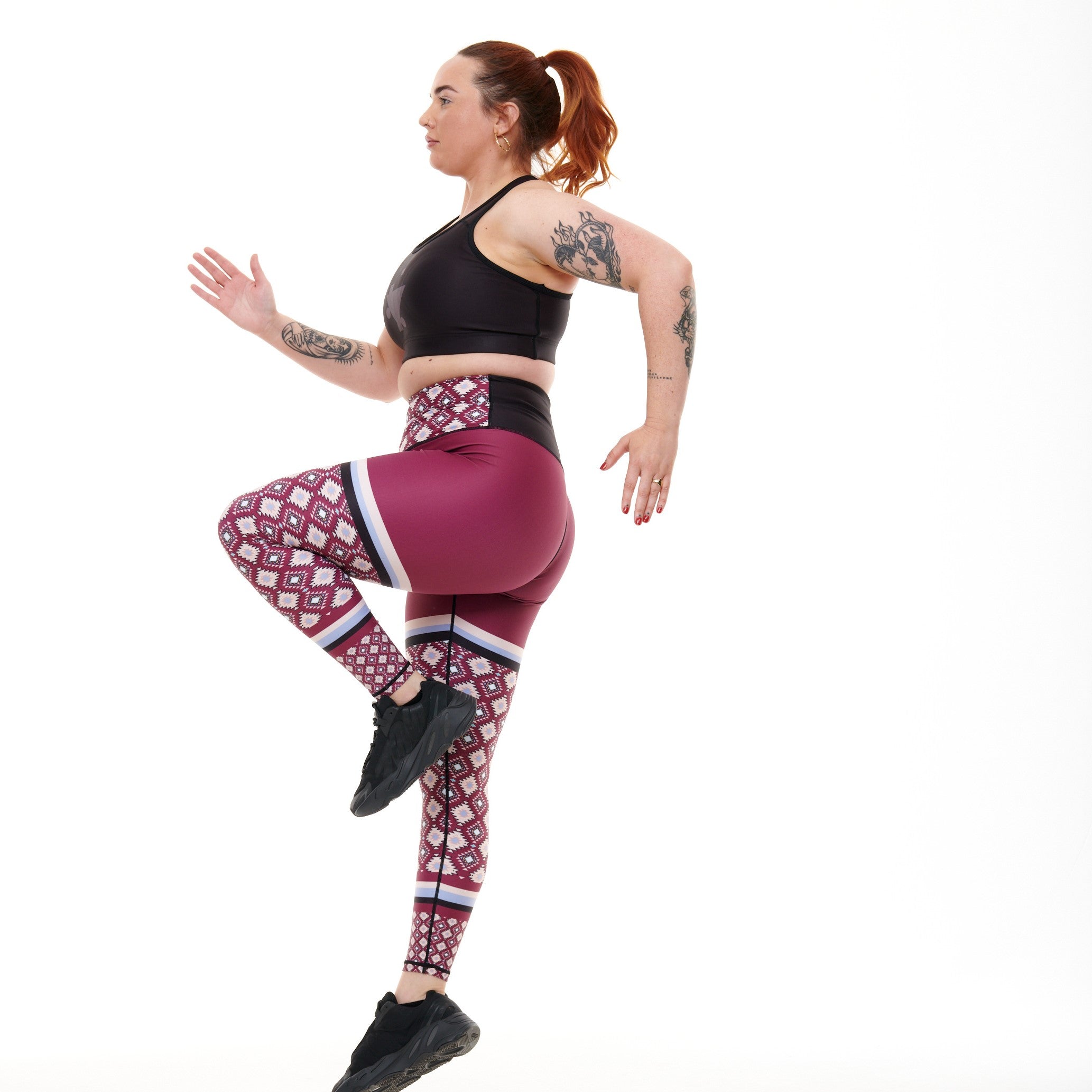 A pair of Go West Funky Leggings featuring a vibrant Aztec print in soft color tones, designed for high performance and comfort.