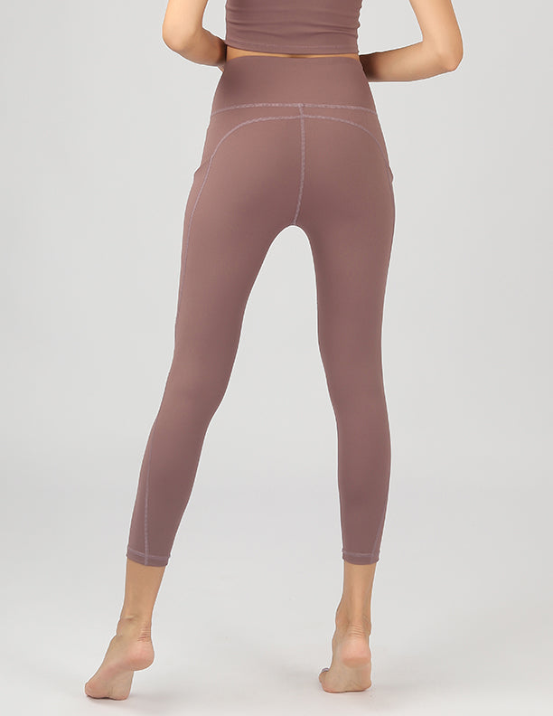 High Waisted Active Leggings in black with side pockets, showcasing 4-way stretch fabric and a flattering fit.