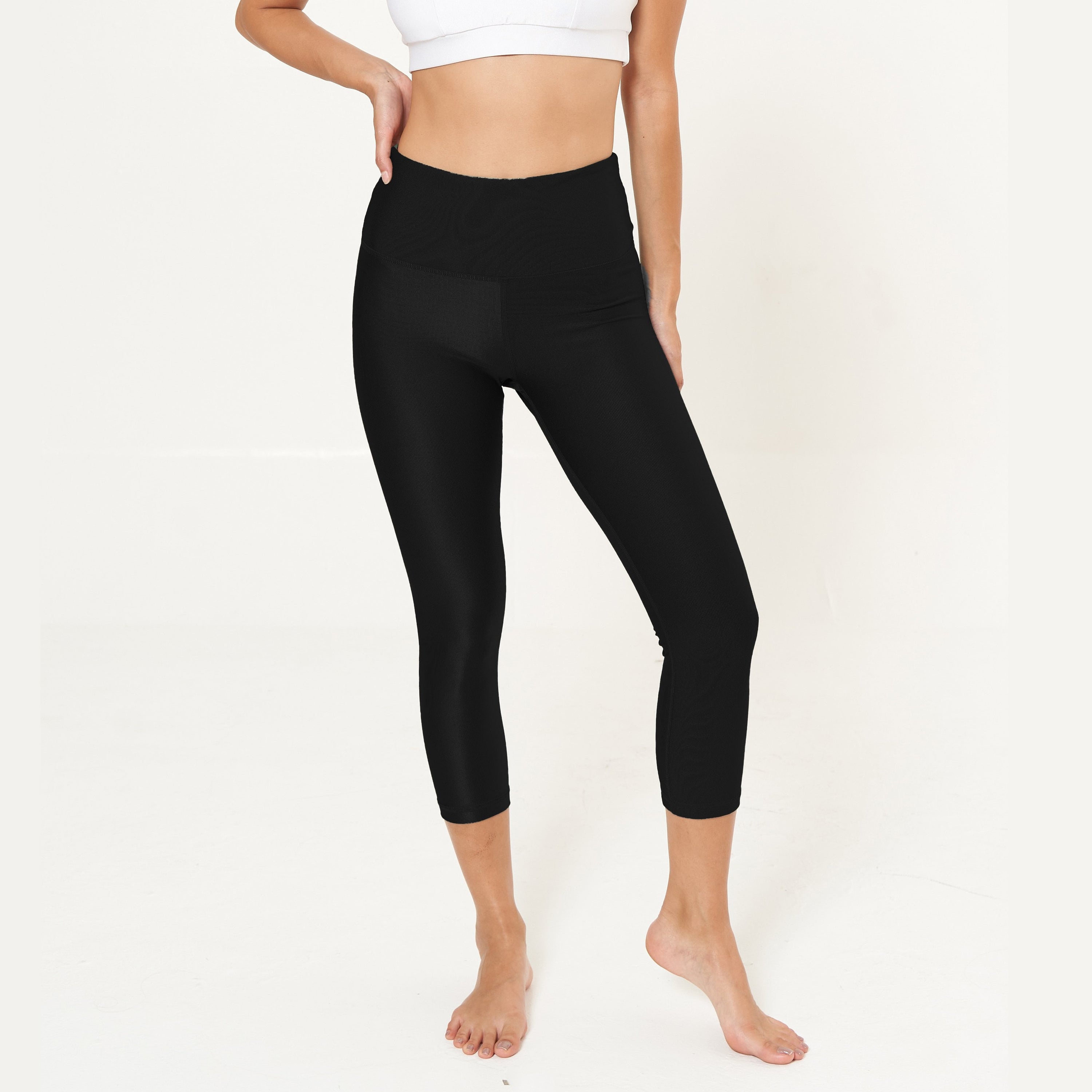 Hi-Rise Capri in Solid Black, featuring a high-rise waistband and comfortable fit, perfect for workouts and daily wear.