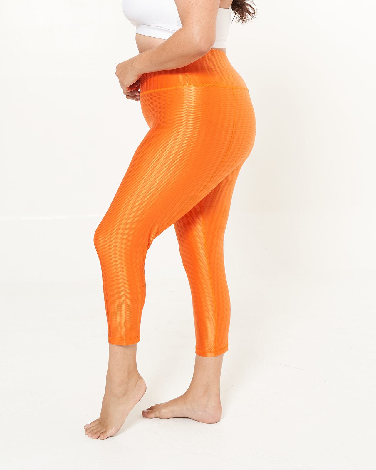 Hi-Rise Capri in Tangerine Zap pattern, showcasing vibrant colors and a stylish design, perfect for workouts and daily wear.