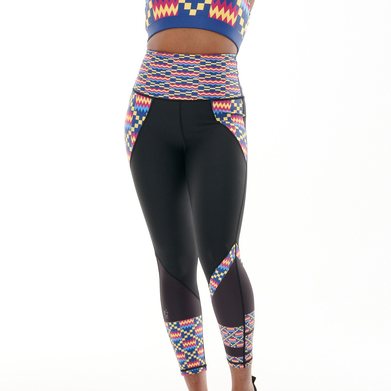 Kayentee Cerulean Butiful Leggings featuring a vibrant geometric pattern in Cerulean Blue, Cerise, Black, and Yellow, designed for high-performance workouts.