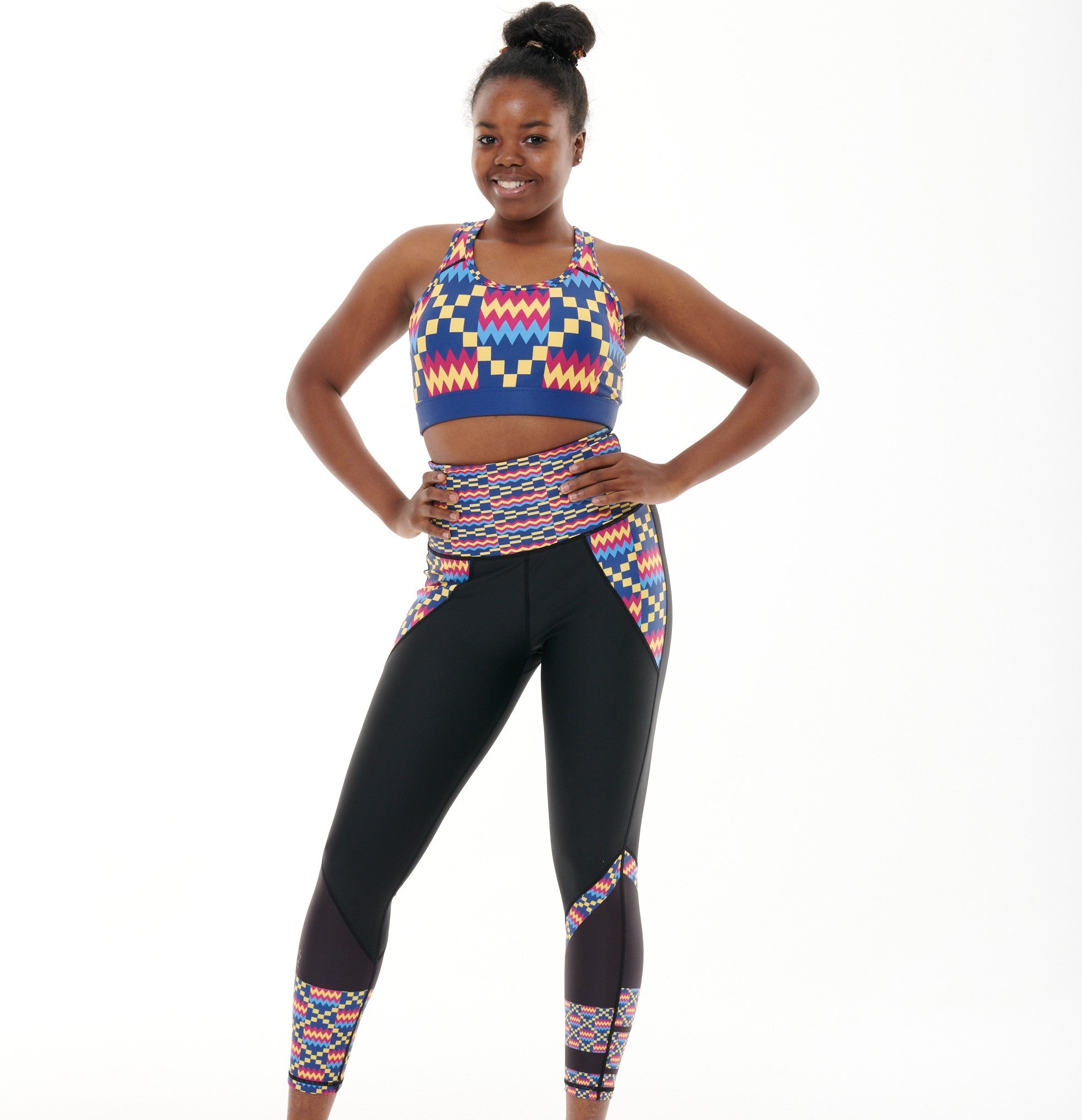 Kayentee Cerulean Butiful Leggings featuring a vibrant geometric pattern in Cerulean Blue, Cerise, Black, and Yellow, designed for high-performance workouts.