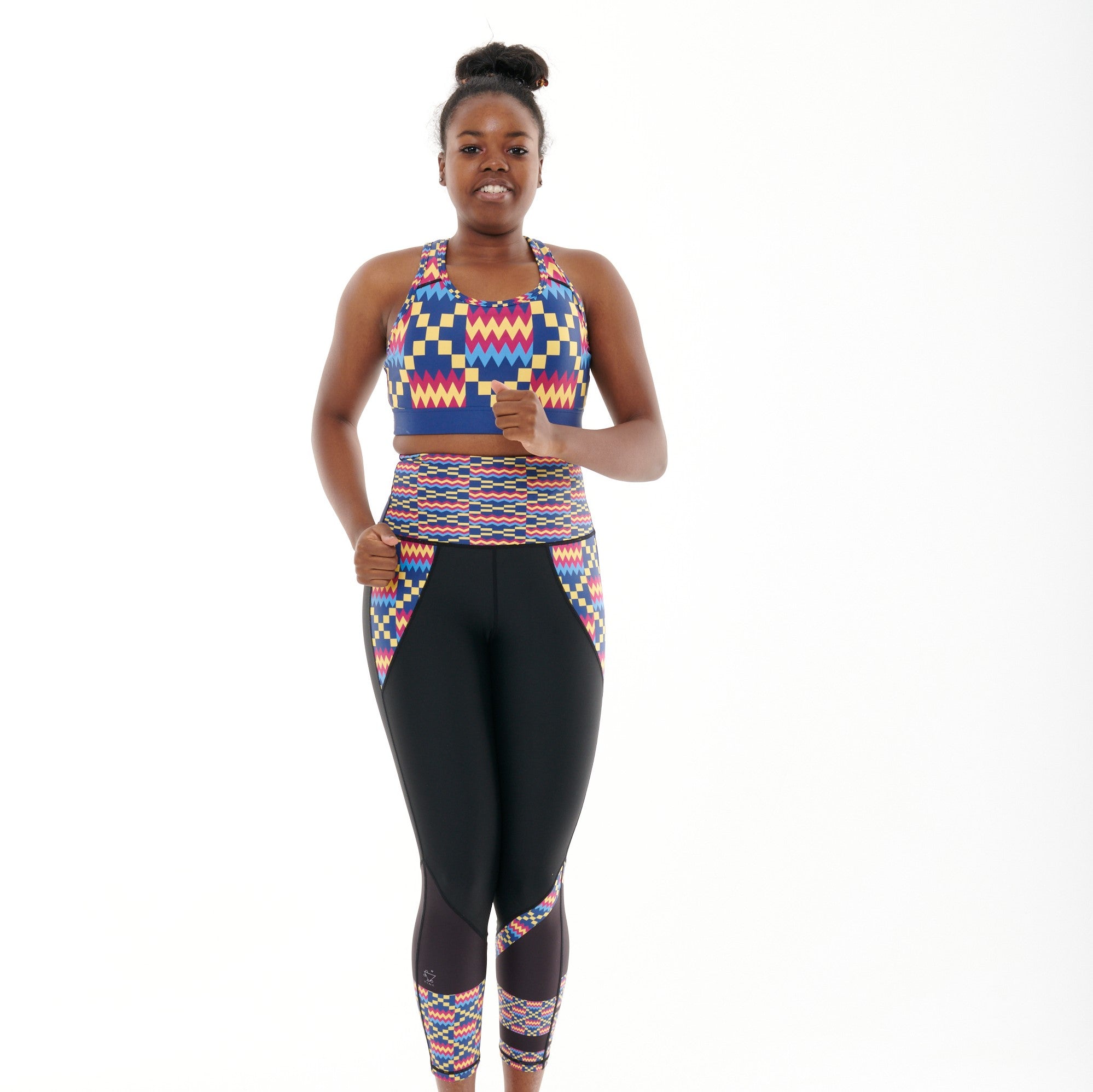 Kayentee Cerulean Butiful Leggings featuring a vibrant geometric pattern in Cerulean Blue, Cerise, Black, and Yellow, designed for high-performance workouts.