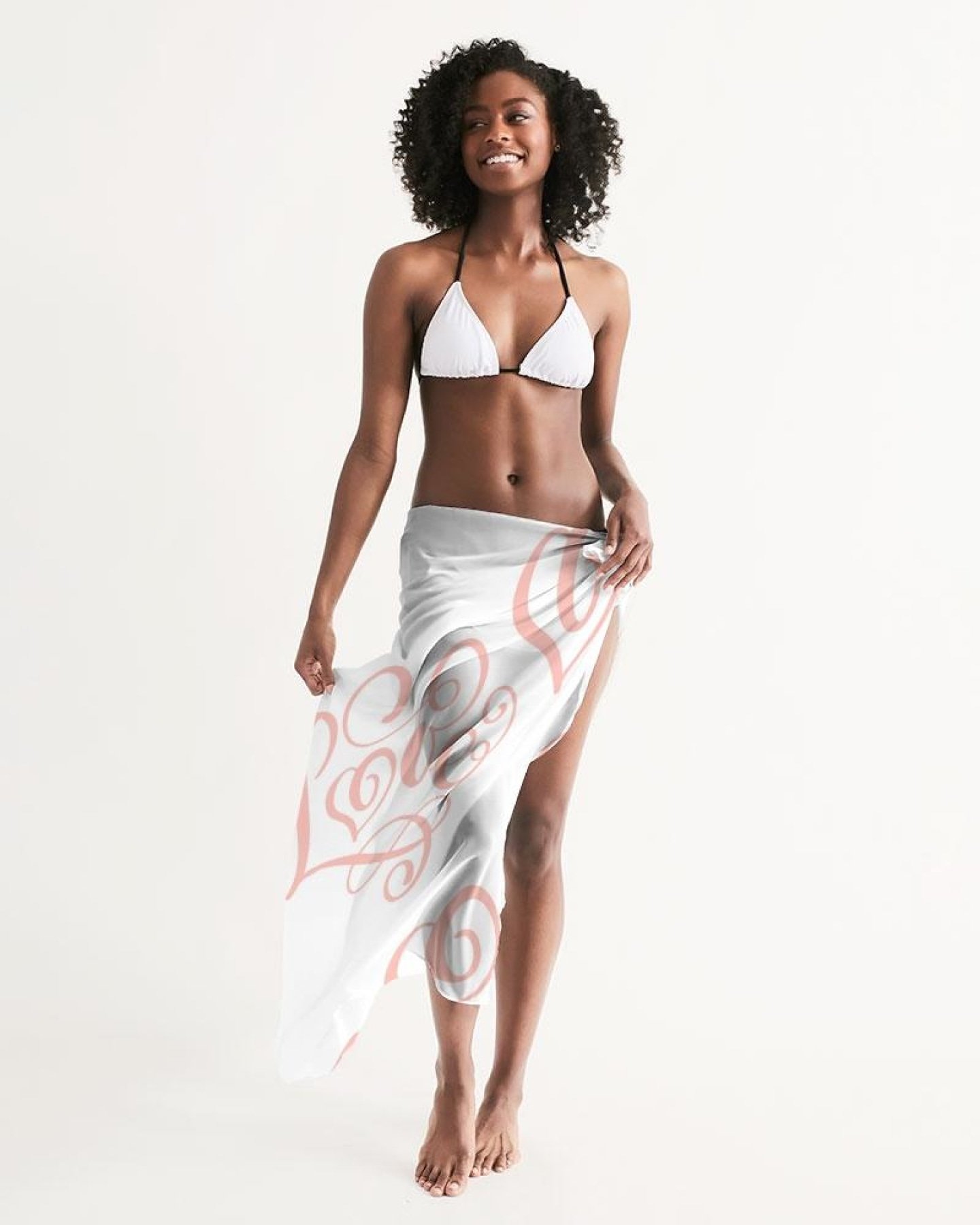 A lightweight pink swimsuit cover up dress with a flowing design and self-tie closure, perfect for beach or poolside wear.