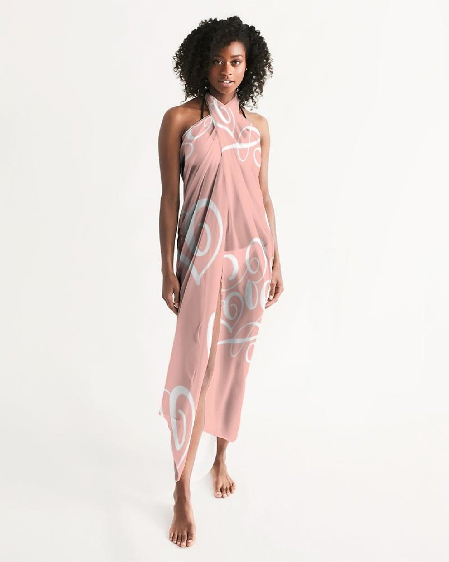 A sheer soft pink swimsuit cover up dress with a love word art illustration, perfect for beach and pool outings.