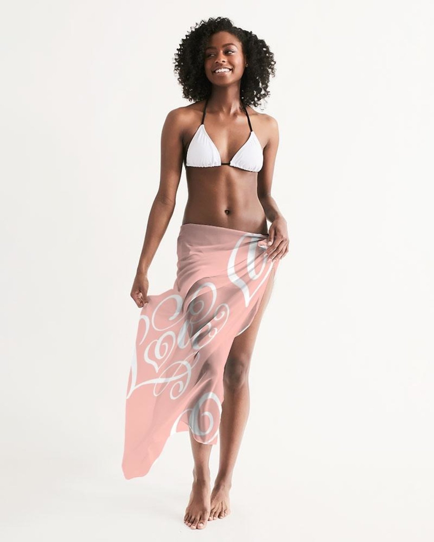 A sheer soft pink swimsuit cover up dress with a love word art illustration, perfect for beach and pool outings.