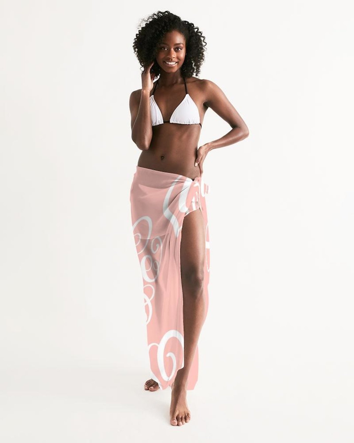 A sheer soft pink swimsuit cover up dress with a love word art illustration, perfect for beach and pool outings.