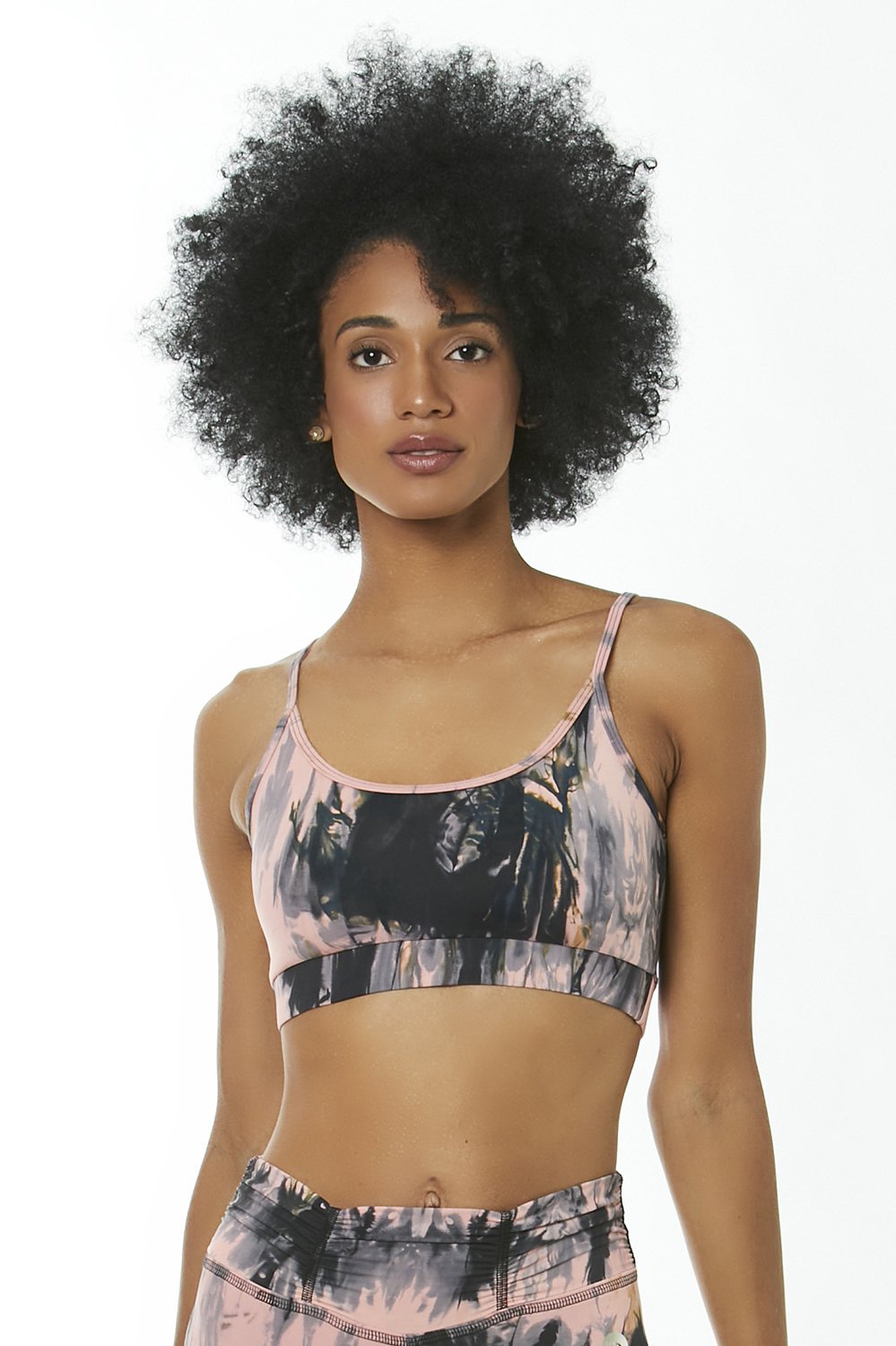 STORM Tie Dye Sports Bra featuring a vibrant tie dye pattern, lightweight fabric, and removable padding for medium support.
